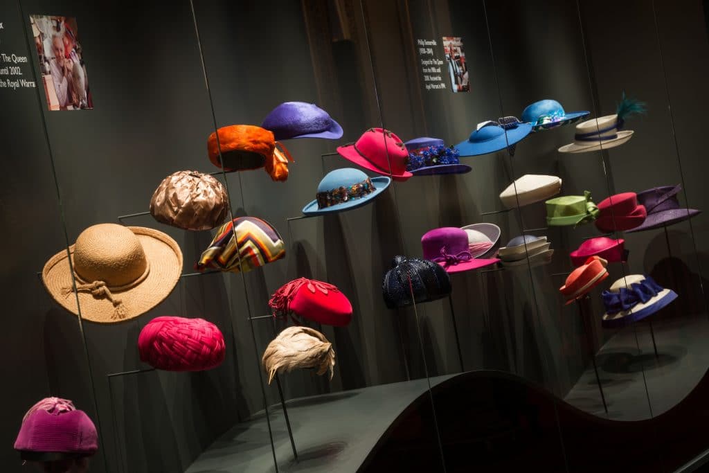 A display of The Queen's hats from Fashioning a Reign: 90 Years of Style from The Queen's Wardrobe at Buckingham Palace