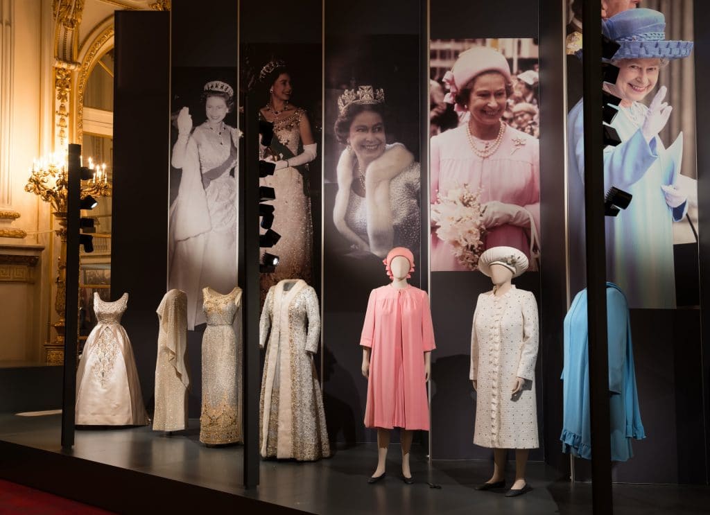 A display of dresses from Fashioning a Reign: 90 Years of Style from The Queen's Wardrobe on display at Buckingham Palace. Images for use only in connection with the exhibition Fashioning a Reign: 90 Years of Style from The Queen's Wardrobe at the Summer Opening of Buckingham Palace