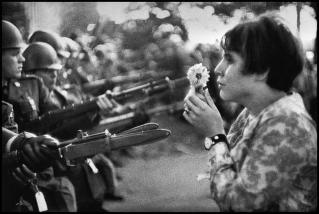 USA. Washington DC. 1967. An American young girl, Jan Rose KASMIR, confronts the American National Guard outside the Pentagon during the 1967 anti-Vietnam march. This march helped to turn public opinion against the US war in Vietnam © Marc Riboud/Magnum Photos