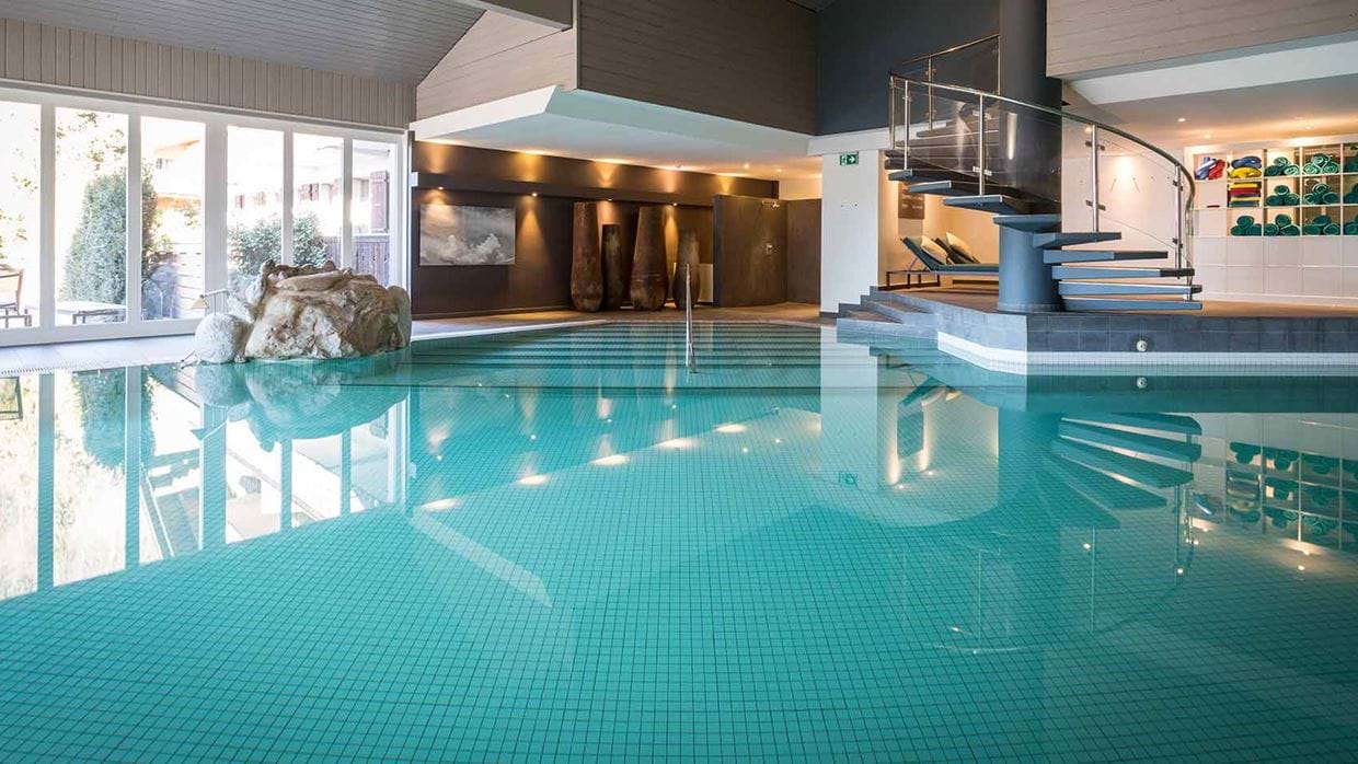 Huus Hotel Gstaad Saanen Switzerland swimming pool